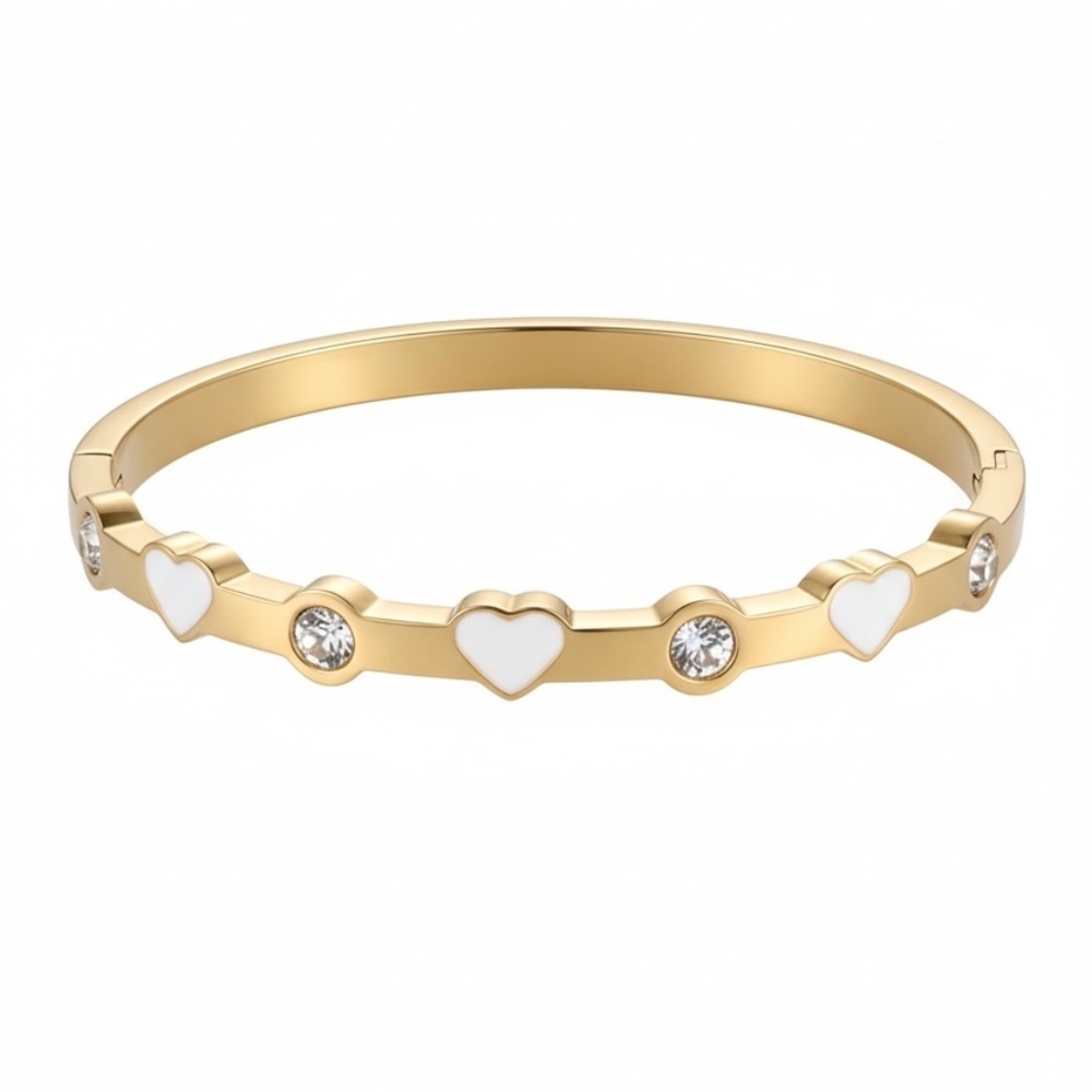 This chic bracelet showcases a beautiful gold finish with delicate white heart d